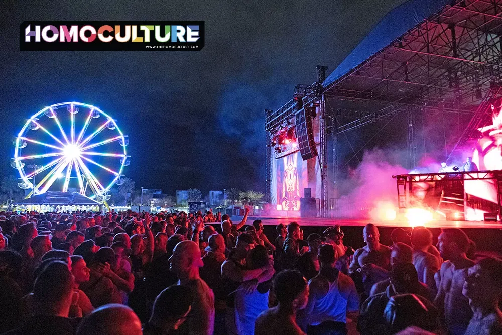 A large crowd dacing in front of the main stage at the Pharoh T-Dance at White Party Palm Springs 2024.