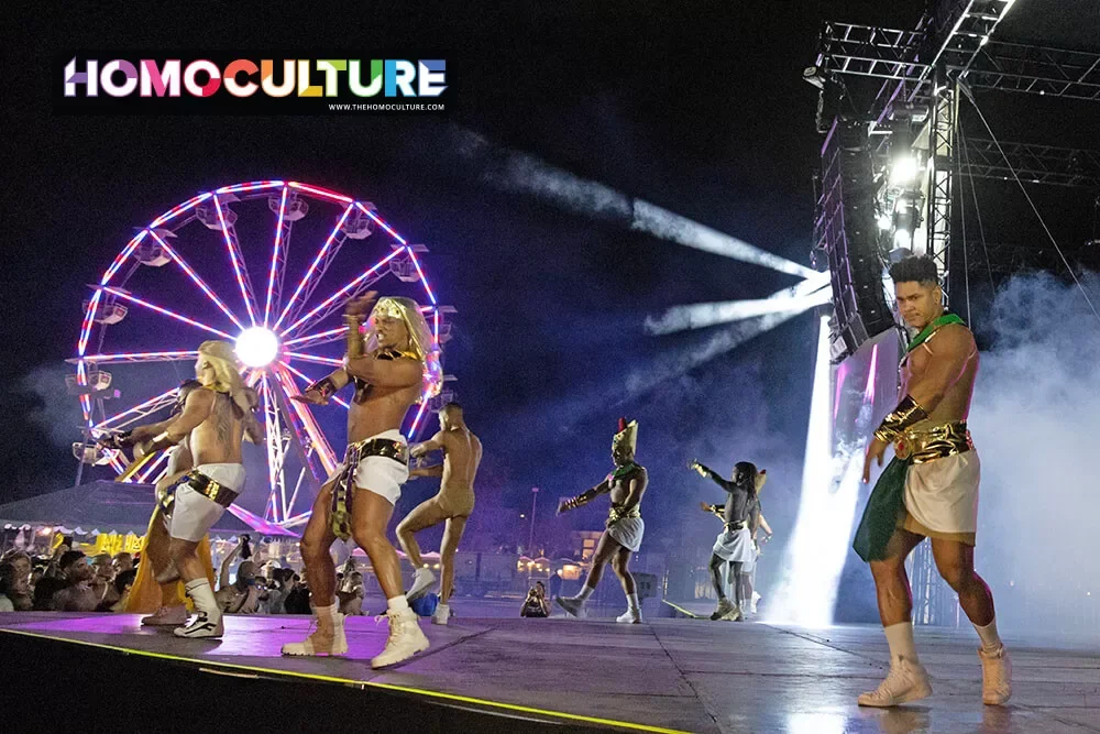 A group of dancers in Pharoh-themed costumes performing at the Pharoh T-Dance during White Party Palm Springs 2024. 
