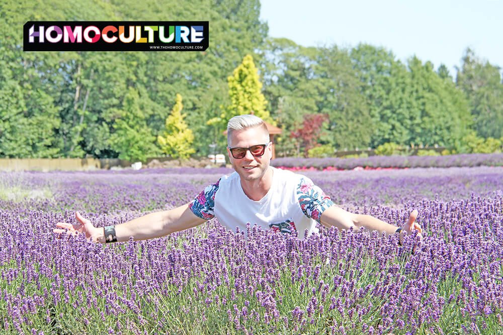 A gay man in a lavendar field.