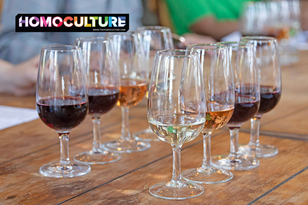Wine tasting flight at Highgate Wine Estate near Durban, South Africa, featuring a variety of red, white, and rosé wines served on a rustic wooden table.