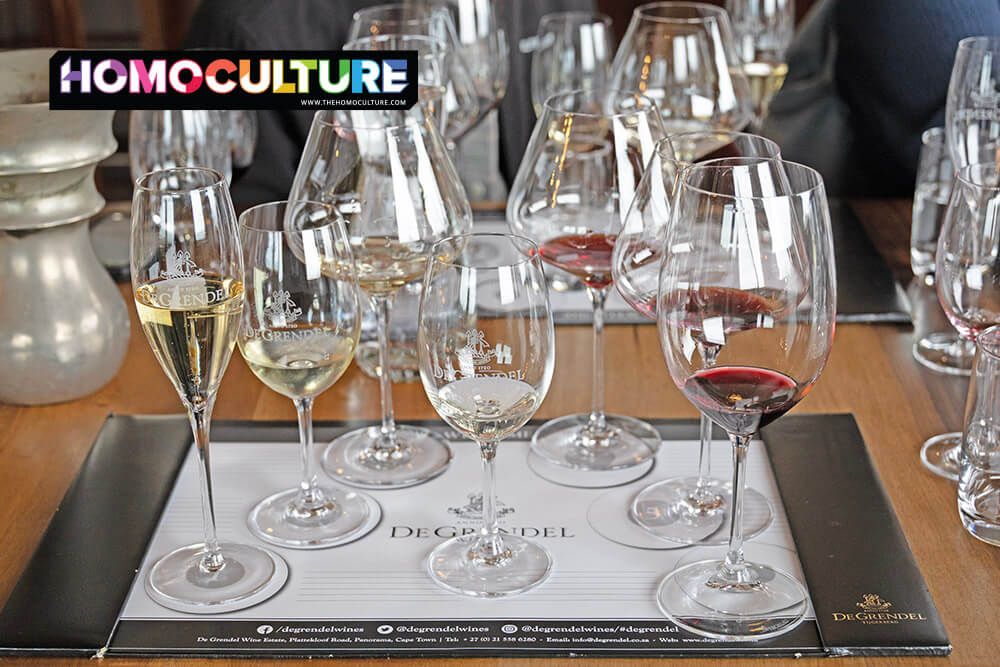 DeGrendel Wine Estate tasting mat with an assortment of sparkling, white, and red wines served in branded glassware during a curated tasting near Cape Town, South Africa.
